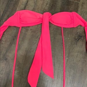 A neon pink bathing suit top!